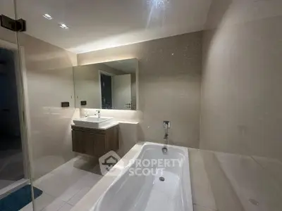 Modern bathroom with sleek design and built-in bathtub