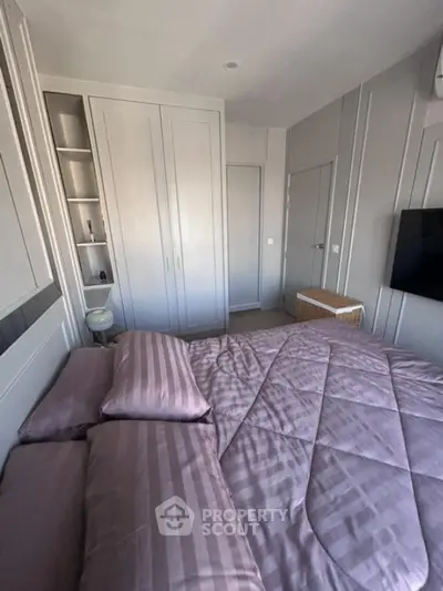 Cozy bedroom with stylish decor and ample storage space