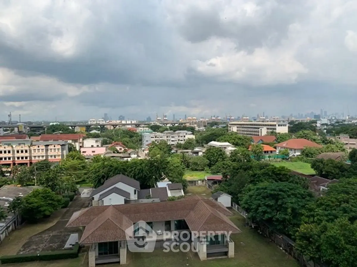 Stunning cityscape view from a high vantage point showcasing lush greenery and urban skyline.