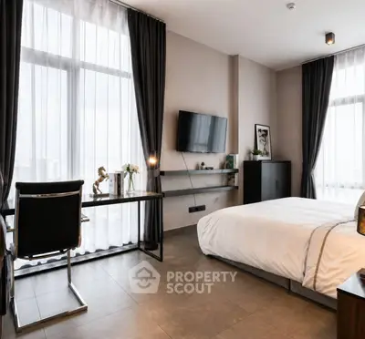 Modern bedroom with sleek design, large windows, and stylish decor