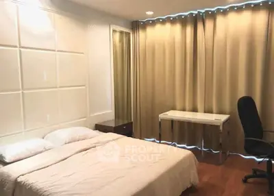 Spacious bedroom with elegant decor and natural light, featuring a comfortable bed and modern furnishings.