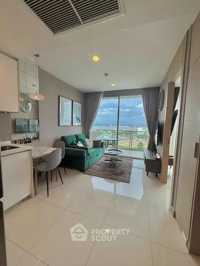 Modern living room with balcony view in high-rise apartment