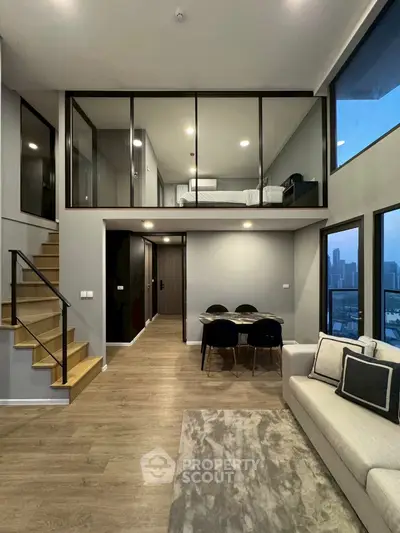 Modern duplex apartment with mezzanine bedroom and city view