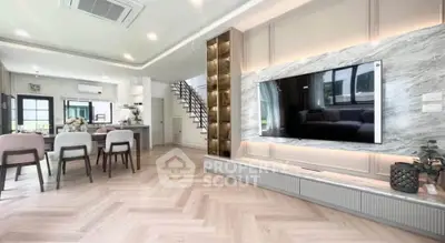 Luxurious open-plan living room with modern decor and stylish kitchen