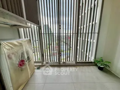 Modern balcony with city view and sleek vertical slats for privacy.