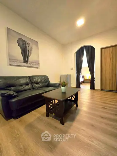 Cozy living room with elegant decor and wooden flooring