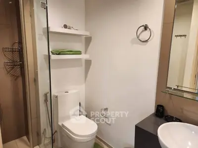 Modern bathroom with glass shower and sleek fixtures, perfect for a contemporary home.