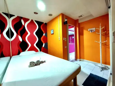 Vibrant bedroom with modern decor and bold accent wall
