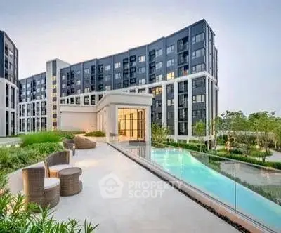 Luxurious modern apartment complex with pool and garden view