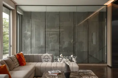 Luxurious modern living room with elegant sofa and glass wall, perfect for stylish urban living.