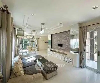 Spacious modern living room with elegant decor and large windows