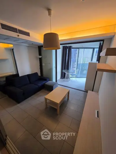 Modern living room with cozy sofa and balcony view