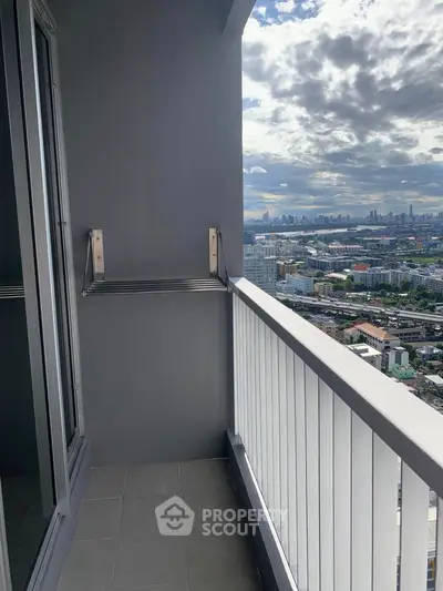 Stunning balcony view of city skyline from high-rise apartment