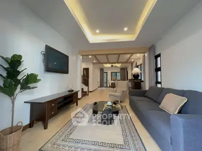 Spacious living room with modern decor and elegant lighting