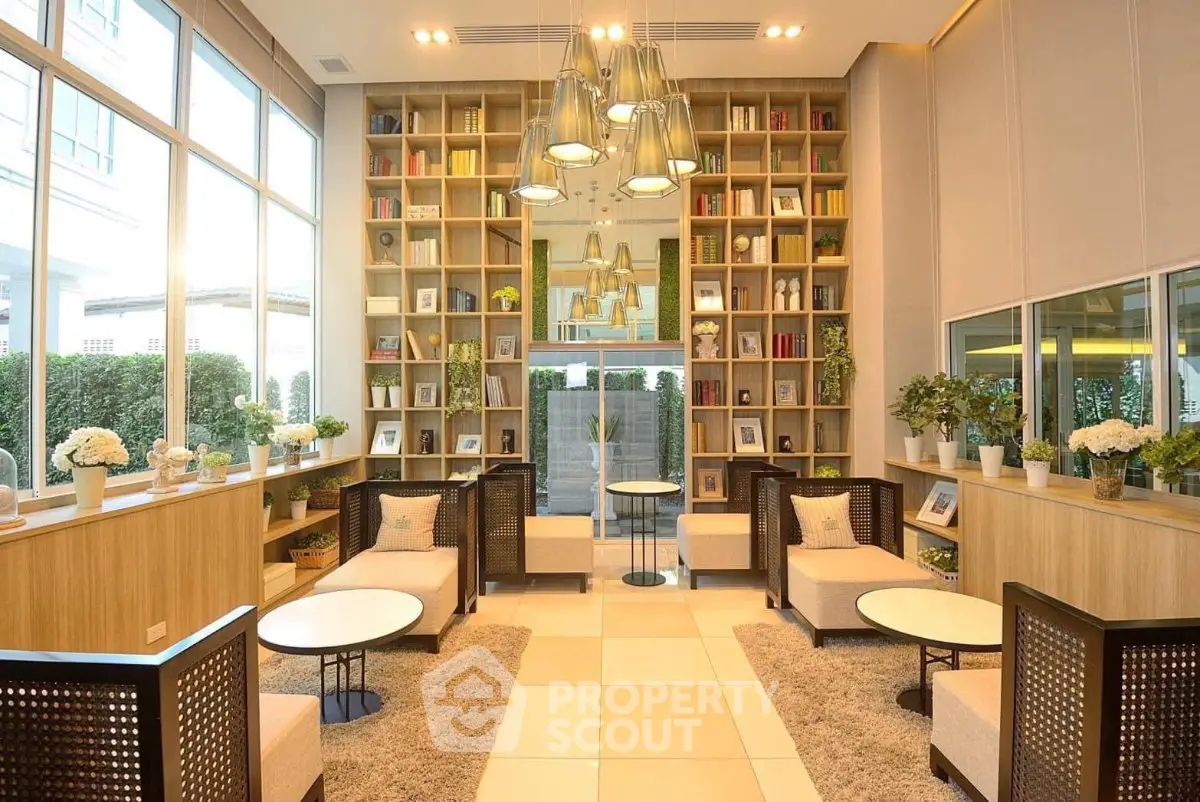 Luxurious modern living room with high ceilings, large windows, and elegant decor in a stylish apartment.