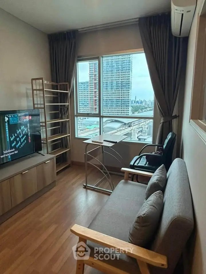 Cozy living room with city view, modern furniture, and large window for natural light.