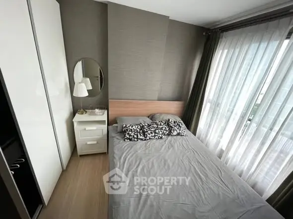 Modern bedroom with stylish decor and natural light