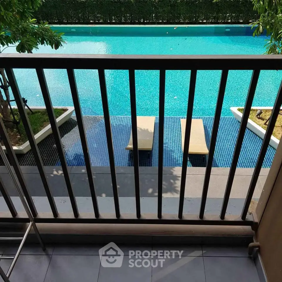 Luxurious pool view from a private balcony, perfect for relaxation and leisure.