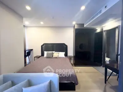 Modern bedroom with stylish decor and cozy ambiance in a contemporary apartment.