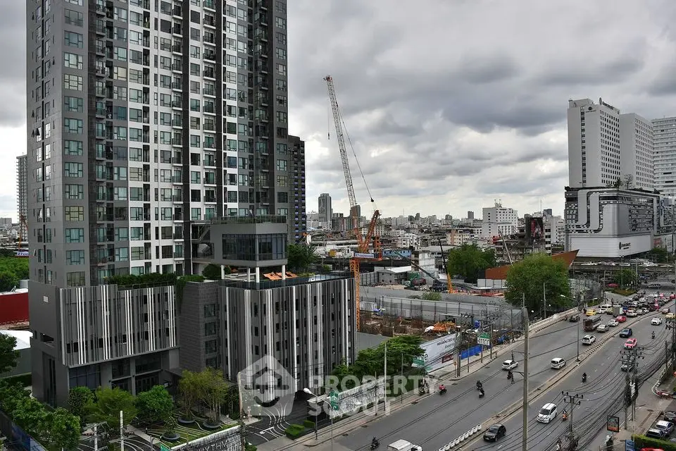 Modern urban high-rise building with cityscape view and construction site