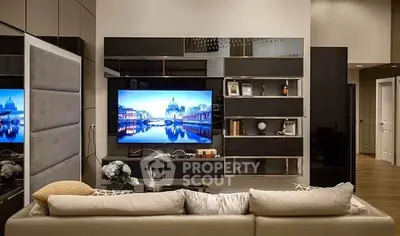 Luxurious modern living room with sleek entertainment center and plush sofa.