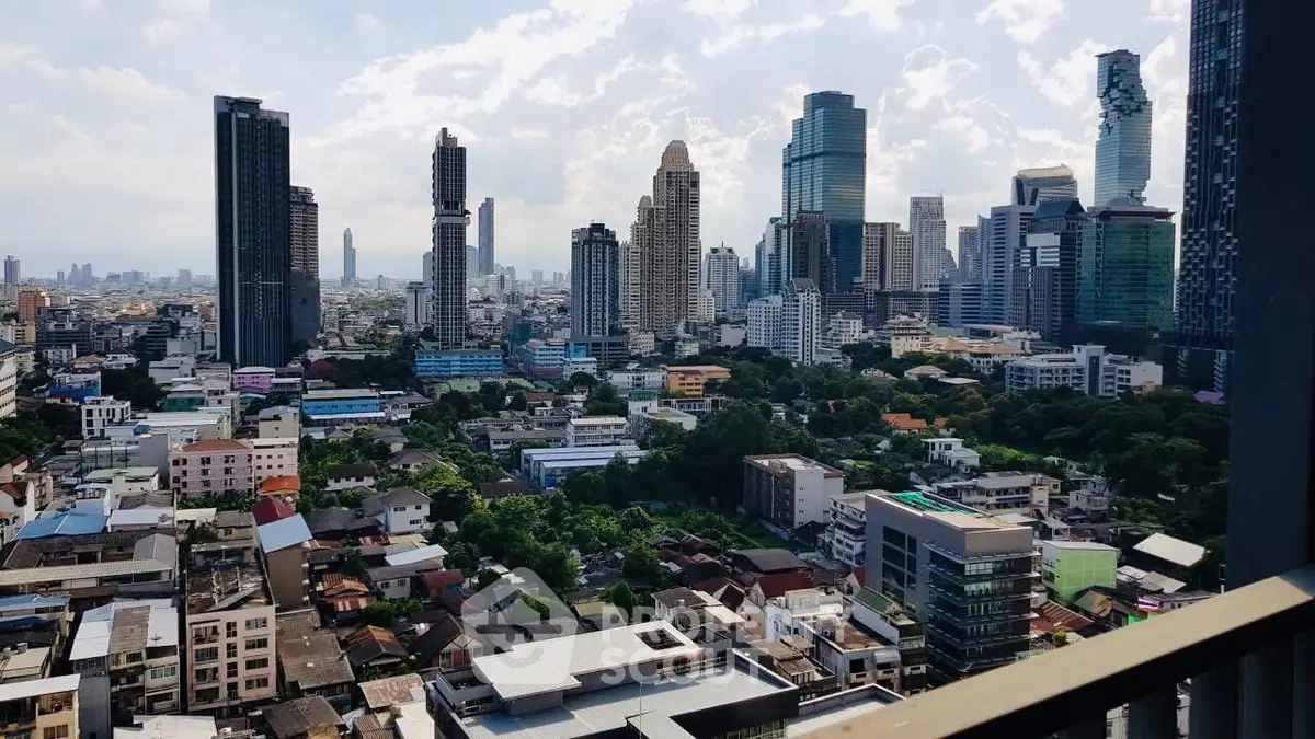 Stunning cityscape view from a high-rise balcony overlooking urban skyline.