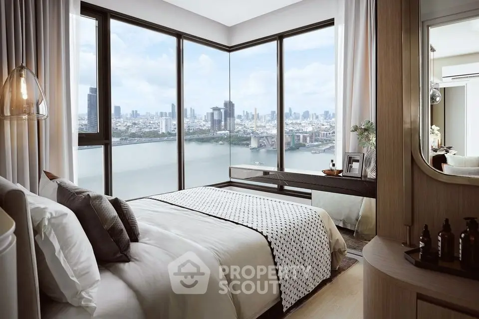 Luxurious bedroom with stunning city and river view from corner windows.