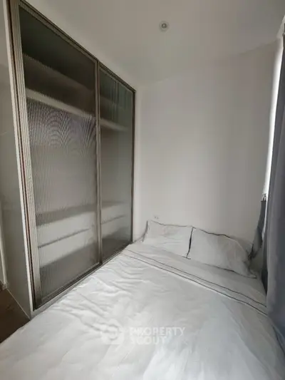 Cozy bedroom with minimalist design and sliding closet doors