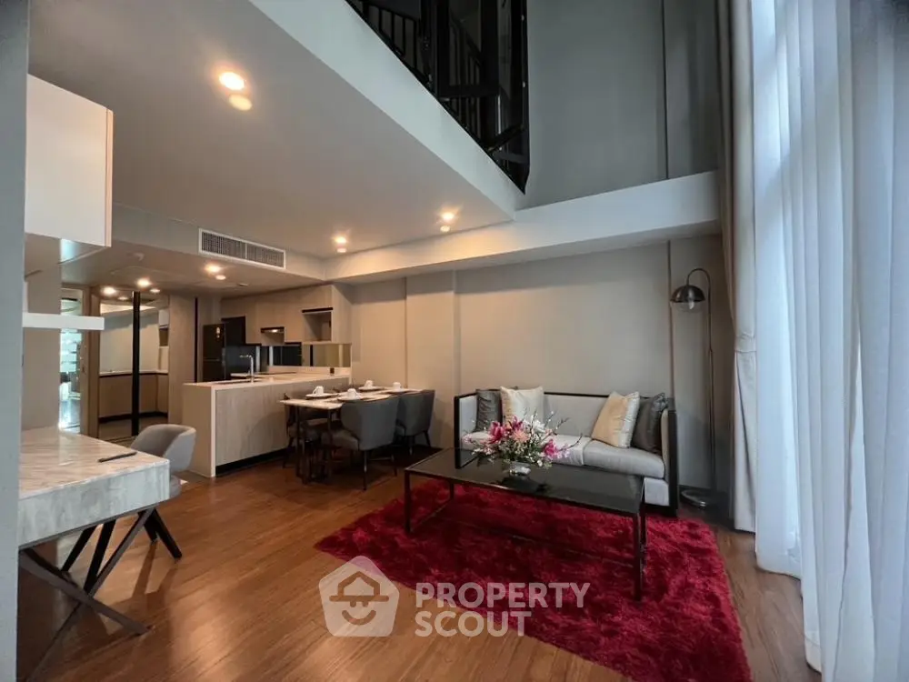 Spacious modern living room with high ceilings and elegant decor