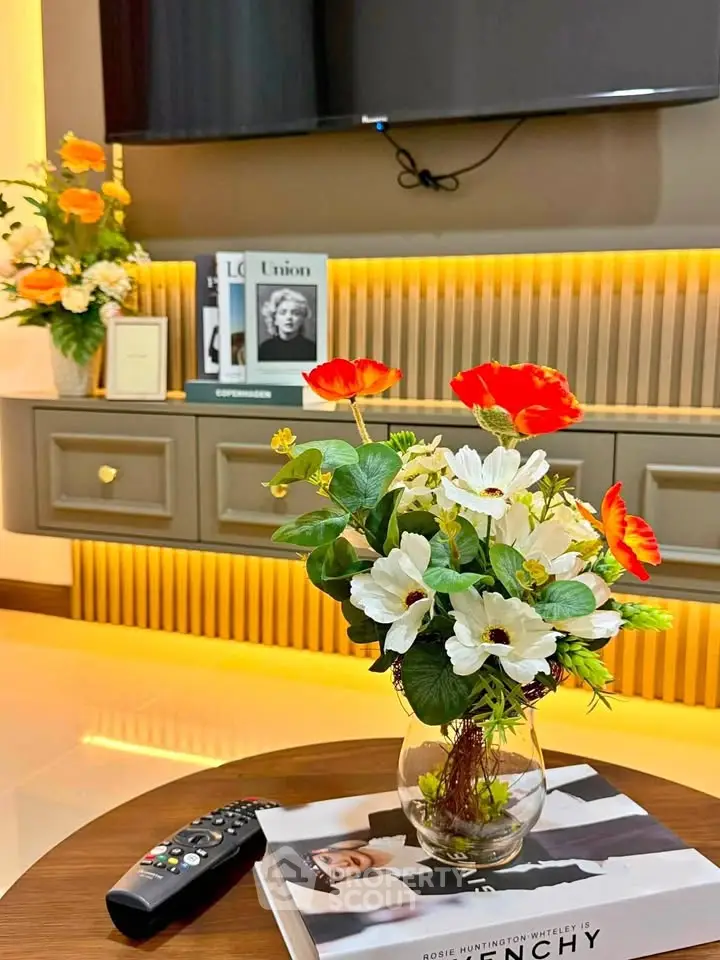 Stylish living room with modern decor and vibrant floral arrangement
