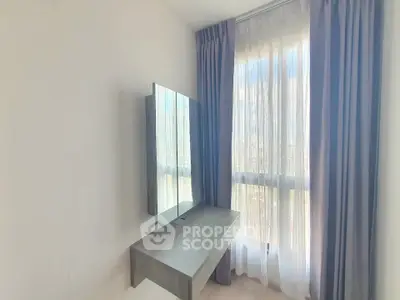Bright bedroom corner with modern desk and large window view
