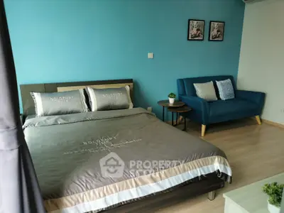 Modern bedroom with stylish decor and cozy seating area