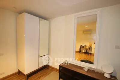 Modern bedroom with sleek wardrobe and stylish decor