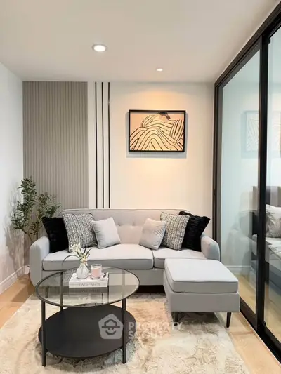 Stylish modern living room with elegant decor and cozy seating area.