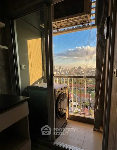 Charming balcony with stunning city view and modern washing machine setup.