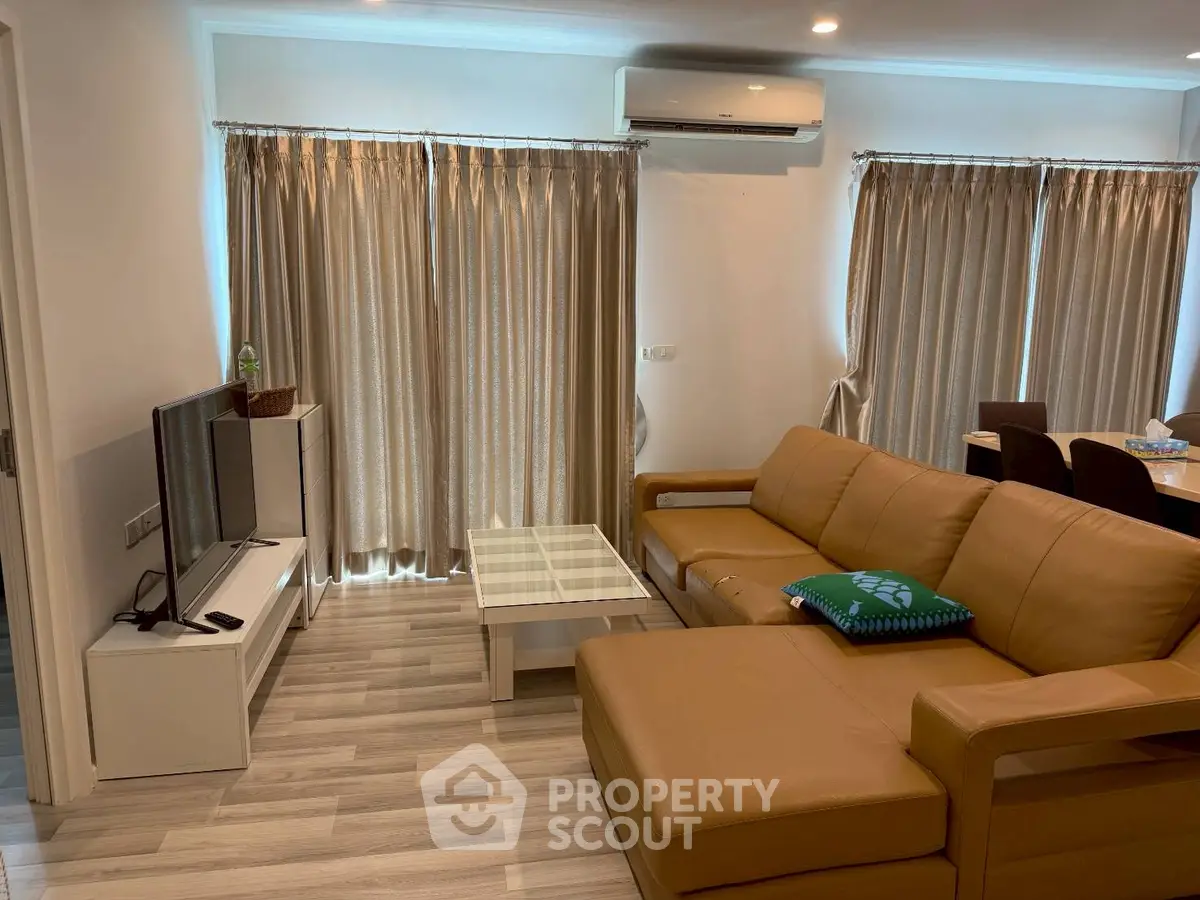 Spacious living room with modern furniture and natural light