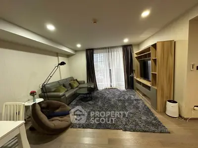 Spacious modern living room with cozy seating and entertainment center