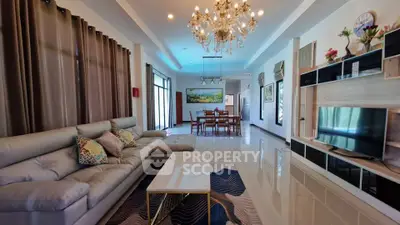 Luxurious living room with elegant chandelier and modern decor