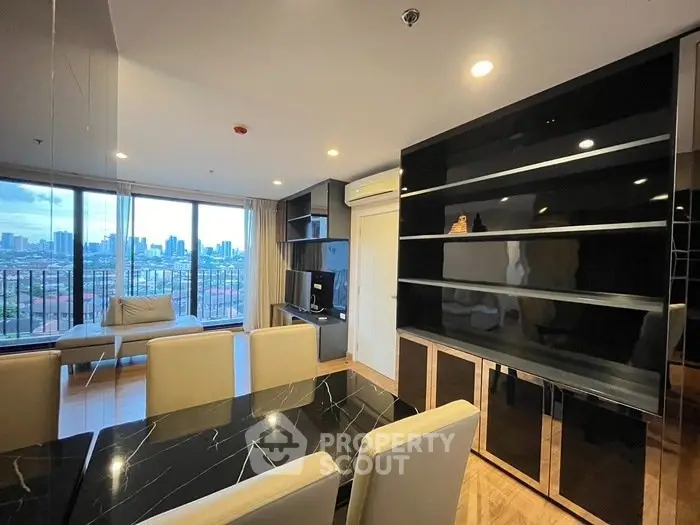 Modern living room with city view and sleek black shelving