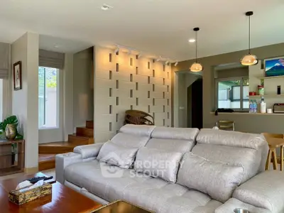 Spacious modern living room with stylish decor and open layout, perfect for relaxation and entertaining.