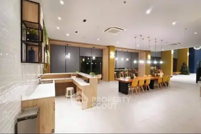 Spacious modern kitchen with open layout and stylish dining area, perfect for entertaining guests.