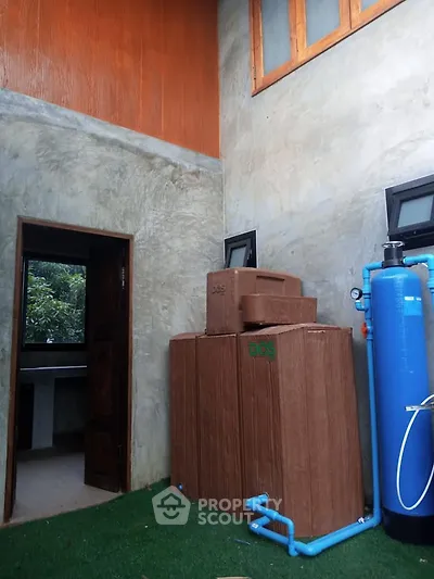 Modern exterior with water filtration system and natural finish walls