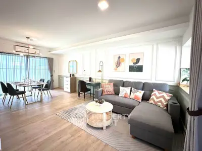 Spacious modern living room with stylish decor and dining area, perfect for entertaining.