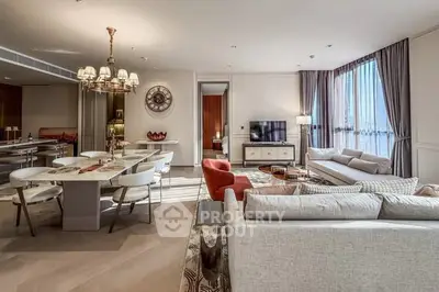 Luxurious open-plan living and dining area with elegant decor and ample natural light.