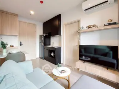 Modern living room with sleek furniture and stylish decor in a contemporary apartment.