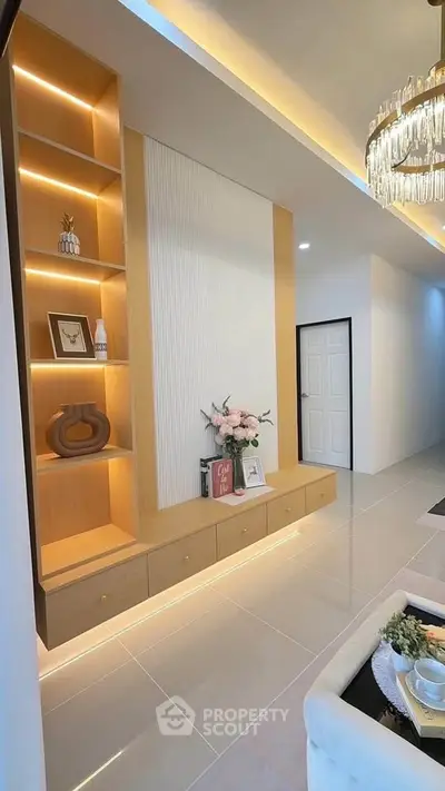 Modern living room with elegant built-in shelving and soft ambient lighting