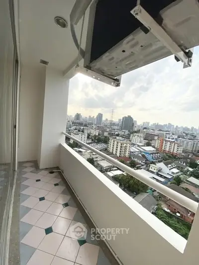 Spacious balcony with stunning city view in high-rise apartment
