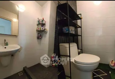 Modern bathroom with sleek fixtures and ample storage space.