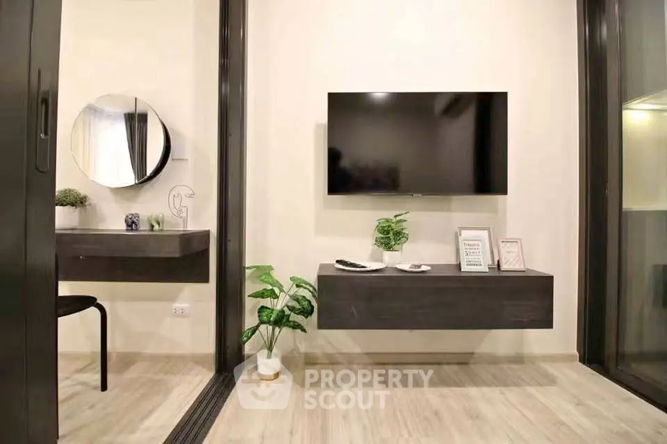 Modern living room with wall-mounted TV and stylish decor