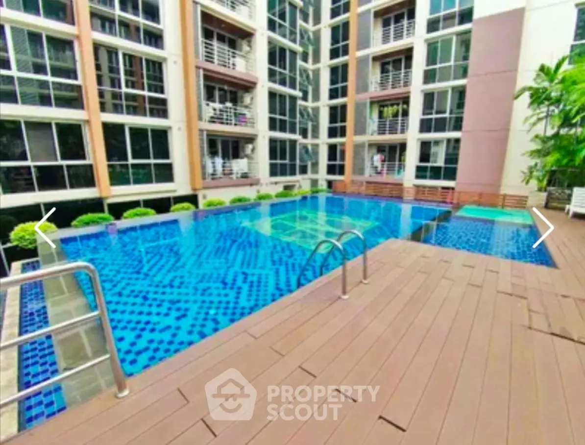 Modern condominium with inviting swimming pool and stylish deck area